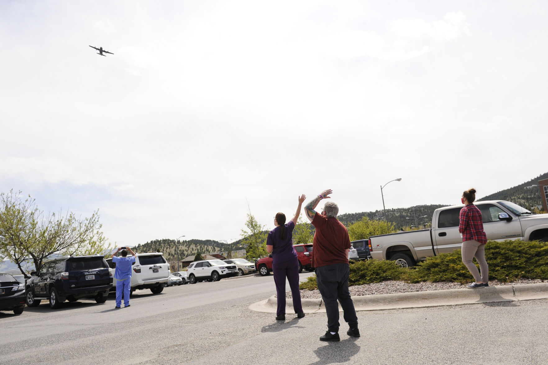 St. Peter's Health staff and nurses wave to a Montana Air National Guard C-130 as it flies over St. Peter's Health Wednesday afternoon.